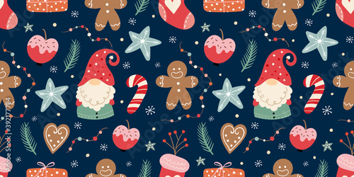 Christmas seamless pattern with gnomes, gingerbread, candies and decoration, winter seasonal design photo