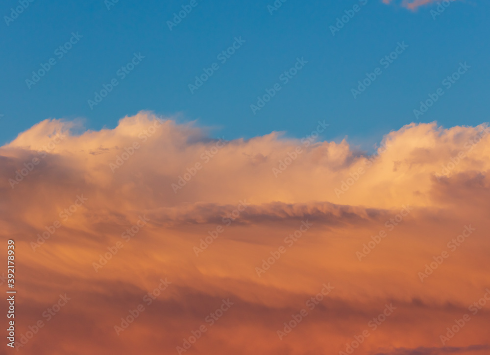 Colorful clouds at sunset as background.