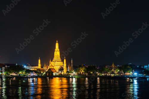 Wat Arun with Chao Phraya river at night in Bangkok, Thailand © geargodz