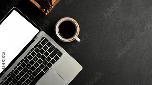 Black concept workspace with laptop, coffee cup and copy space, include clipping path