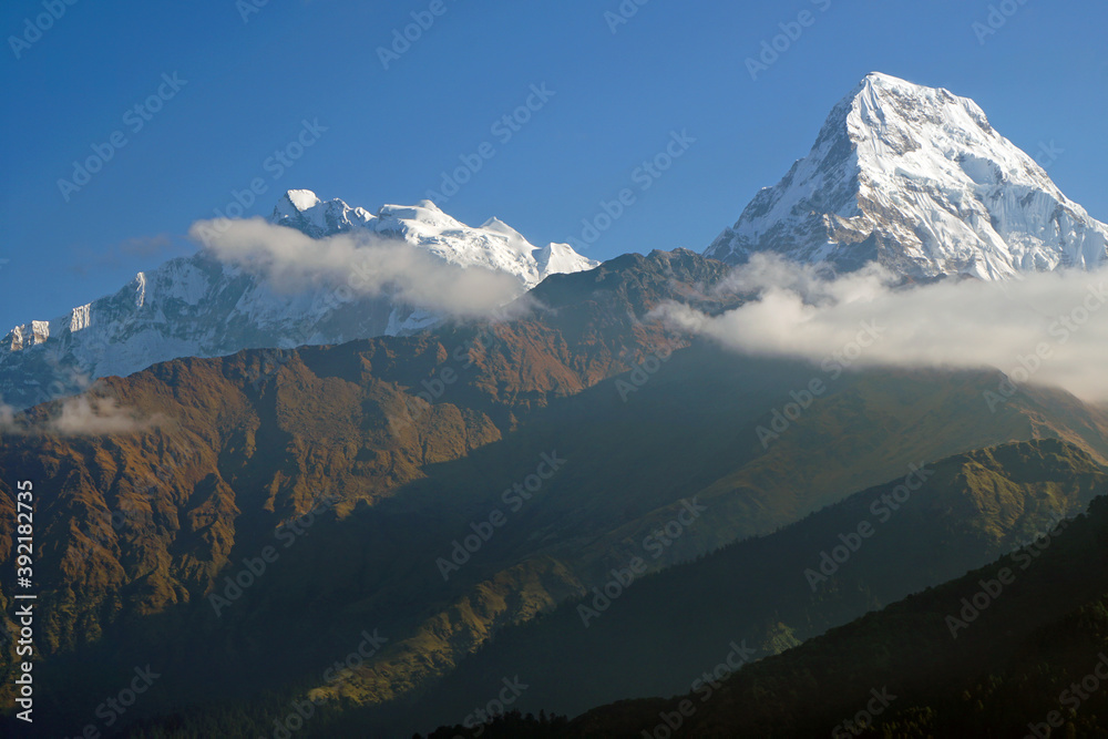 Nature Landscape of Top of Mt. Machapuchare is a mountain in the Annapurna Himalayas of north central Nepal seen from Poon Hill, Nepal - trekking route to ABC - Adventure Backpacking outdoor 