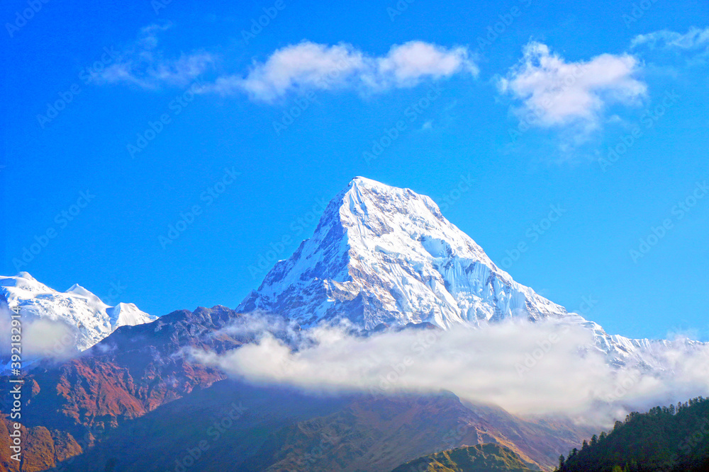 Nature Scene of Top of Mt. Machapuchare is a mountain in the Annapurna Himalayas of north central Nepal seen from Poon Hill, Nepal - trekking route to ABC - Adventure Backpacking outdoor 
