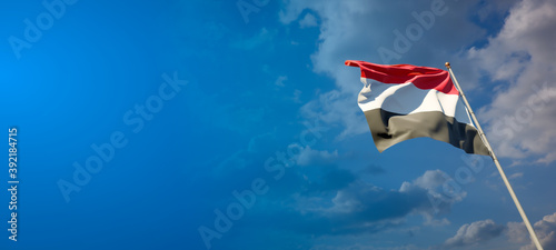 Beautiful national state flag of Yemen with blank space. Yemen flag on wide background with place for text 3D artwork.