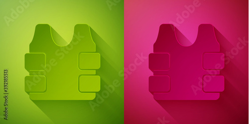 Paper cut Bulletproof vest for protection from bullets icon isolated on green and pink background. Body armor sign. Military clothing. Paper art style. Vector.