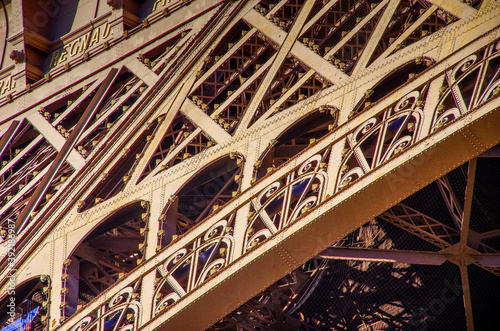 Slanted view of the Eiffel Tower in Paris, detailed view of the iron structures