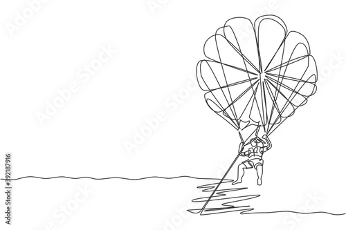 One continuous line drawing of young bravery man flying in the sky using parasailing parachute pulled by a boat. Outdoor dangerous extreme sport concept. Single line draw design vector illustration