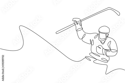 Single continuous line drawing of young professional ice hockey player hit the puck and attack on ice rink arena. Extreme winter sport concept. Trendy one line draw design graphic vector illustration