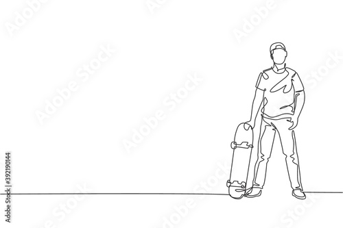 One single line drawing of young skateboarder man holding skateboard and pose in city street vector illustration. Teen lifestyle and extreme outdoor sport concept. Modern continuous line draw design