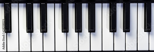 Top close-up view of keys of piano or keyboard