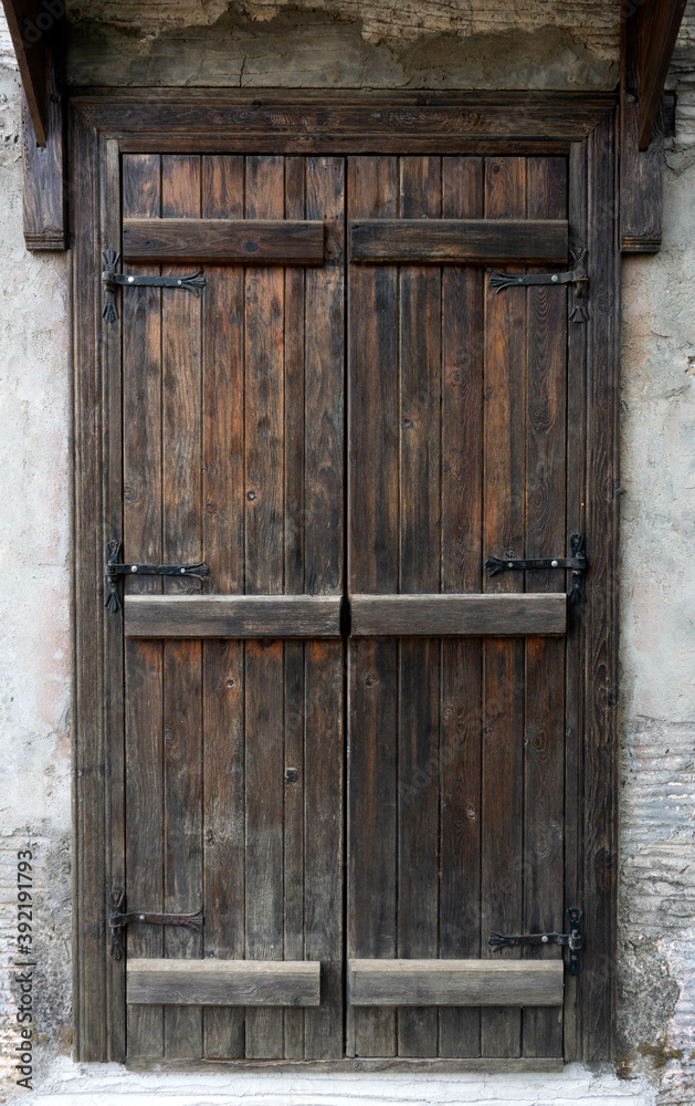 Old wooden door. Texture and pattern of old wooden doors in a stone house  Stock Photo | Adobe Stock