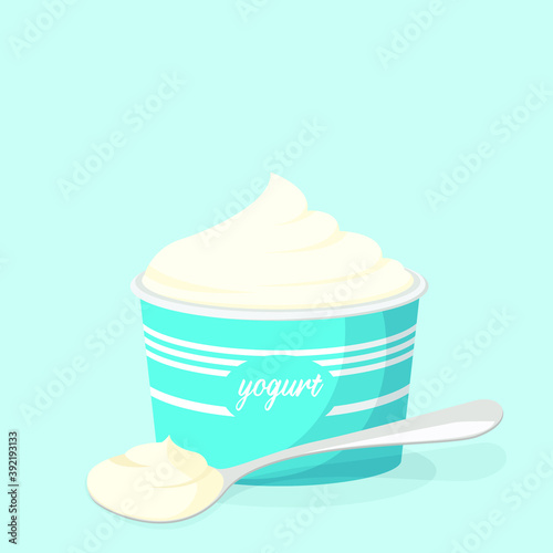 Cup and spoon with yogurt