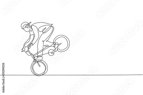 Single continuous line drawing of young BMX cycle rider show extreme risky trick in skatepark. BMX freestyle concept. Trendy one line draw design vector illustration for freestyle promotion media
