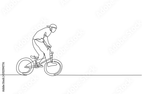 One continuous line drawing of young BMX bicycle rider performing dangerous trick at skatepark. Extreme sport concept vector illustration. Dynamic single line draw design for event promotion poster