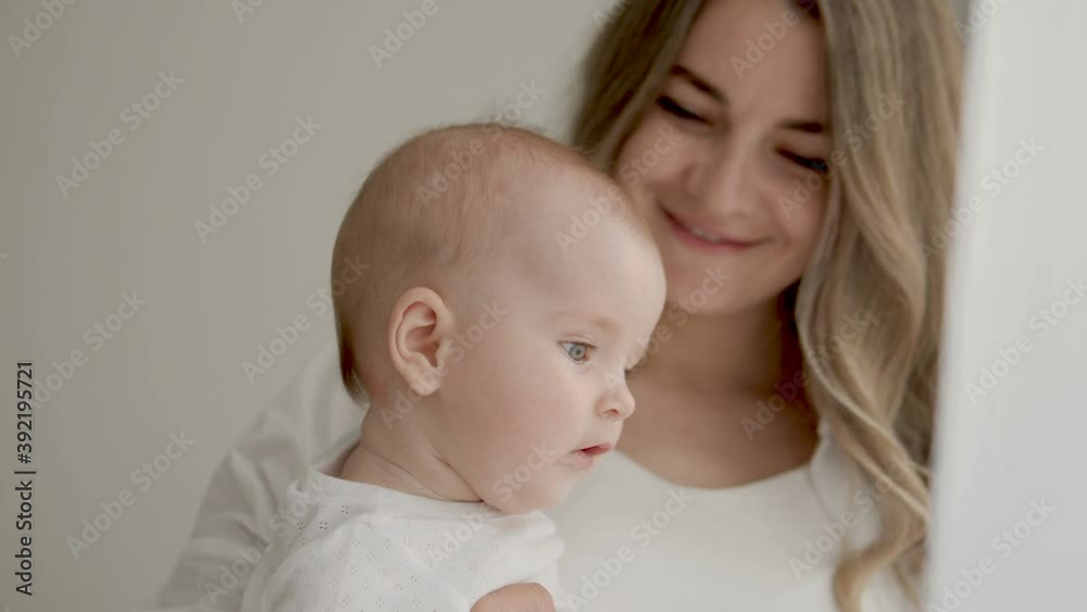 Questioned little kid observing world around, mommy watching son with pleasure Questioned little kid observing world around, mommy watching son with pleasure