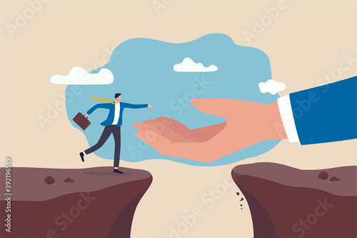Helping hand support in career development, solve business problem or overcome obstacle concept, god hand reach to help or recuse businessman cross the cliffs.