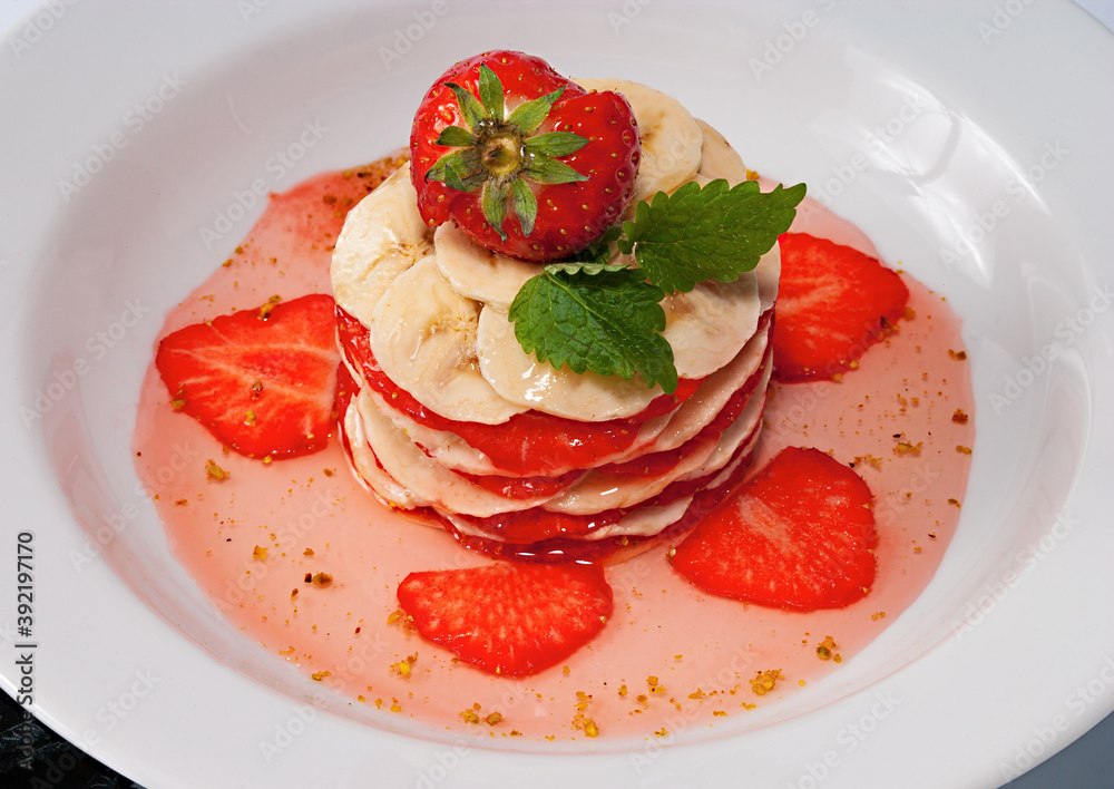 banana and strawberry dessert with syrup banana and strawberry dessert with syrup