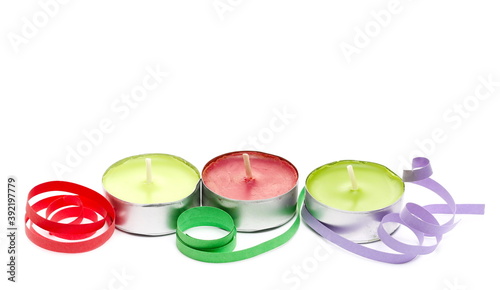 Colorful tea light candles and ribbons, curls isolated on white background, Christmas decoration