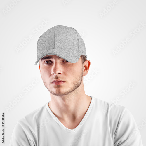 Mockup of gray baseball cap heather on a guy's head, isolated on background.