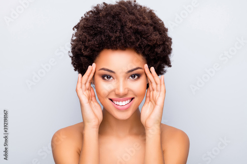 Close up photo of charming afro american girl touch her eyes enjoy skincare cosmetology correction make-up tone skin flawless pure fresh isolated over grey color background