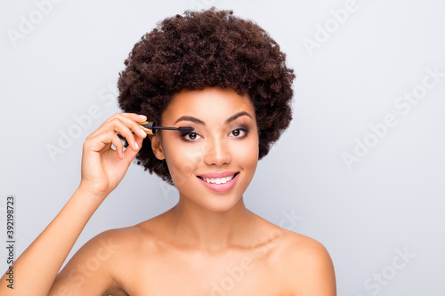 Close-up portrait of nice attractive shine perfect cheerful wavy-haired girl with clean clear pure skin applying new mascara preparing morning isolated on light white gray color pastel background