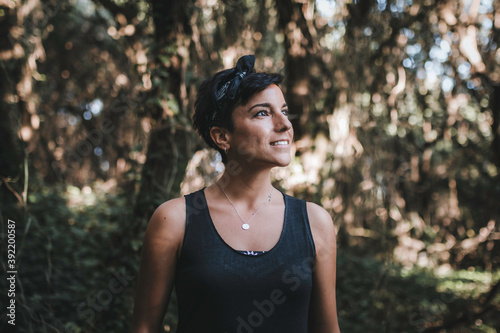 Woman admiring nature in the forest