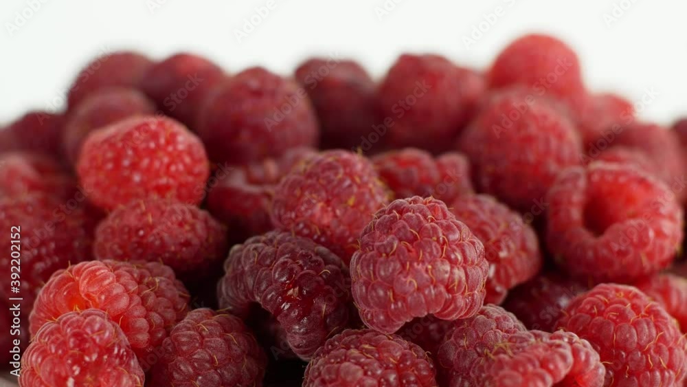 Eco bright colorful berry raspberry rotates 360 on a white background. Close-up of loose raspberry slide 4K video Eco bright colorful berry raspberry rotates 360 on a white background. Close-up of loose raspberry slide 4K video