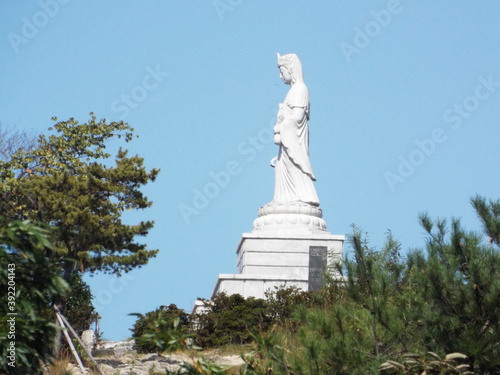 Bongha Village, Gimhae, South Korea, October 8, 2017: Large statue of a goddess on a mountain in Bongha Village, birthplace of Roh Moo-hyun, 16th President of South Korea photo