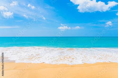 Beautiful tropical beach sea ocean with white cloud and blue sky