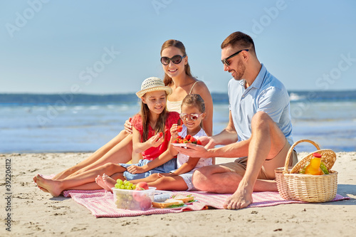 Canvas Print family, leisure and people concept - happy mother, father and two daughters havi