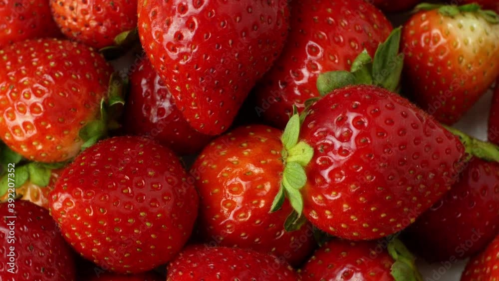 Juicy ripe exotic strawberry rotates on a white background 360. Eco fruits and berries summer. Juicy ripe exotic strawberry rotates on a white background 360. Eco fruits and berries summer.