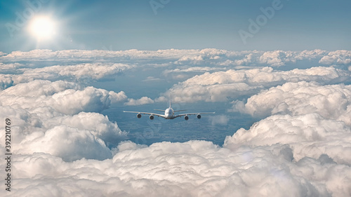 Photography Exterior view of an airplane flying over the clouds
