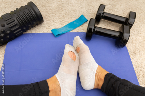 Socks with holes and workout equipment
