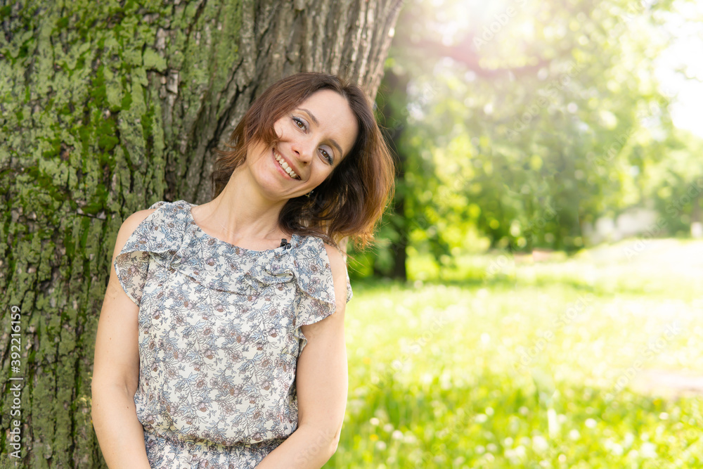 Beautiful woman in a summer Park in nature walking. Beautiful woman in a summer Park in nature walking.