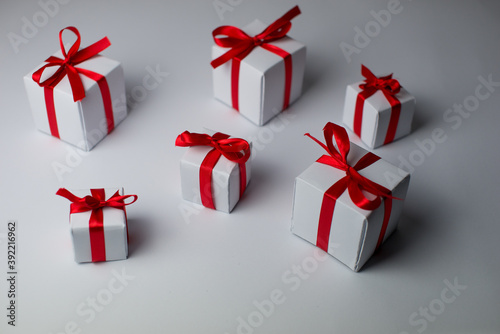 White gifts with red ribbons. Set of gift box isolated on white background.Christmas gift boxes on white background. Merry Christmas and Happy Holidays greeting card, frame, banner. New Year. panorama