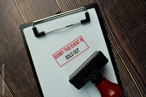 Sorry This Event Is Sold Out write on a book isolated on Wooden Table.