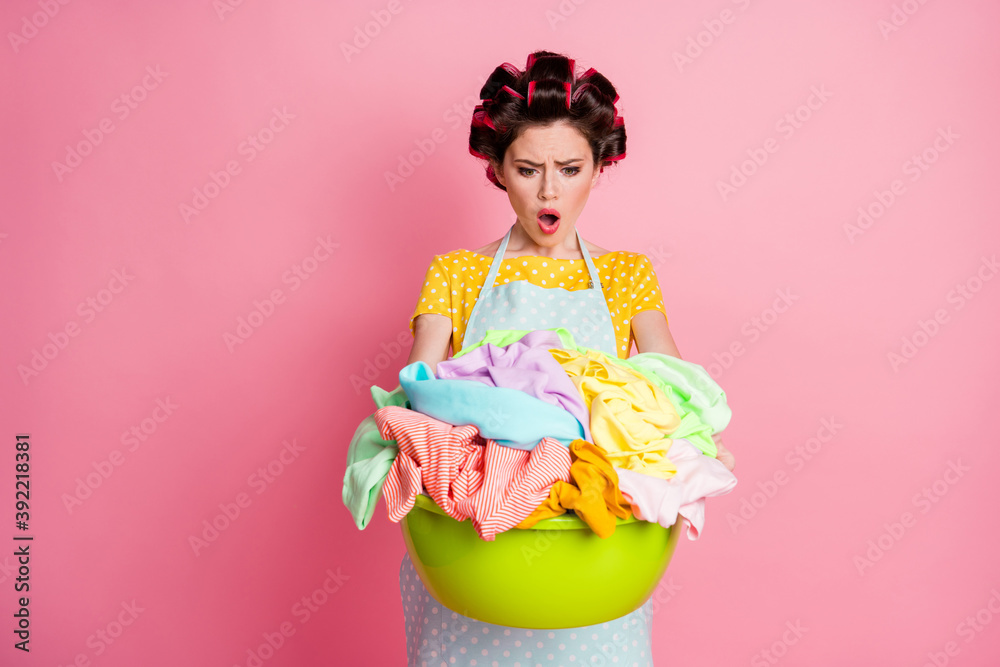 Portrait of her she attractive desperate puzzled overwhelmed housemaid carrying large pile dirty laundry isolated over pink pastel color background Portrait of her she attractive desperate puzzled overwhelmed housemaid carrying large pile dirty laundry isolated over pink pastel color background