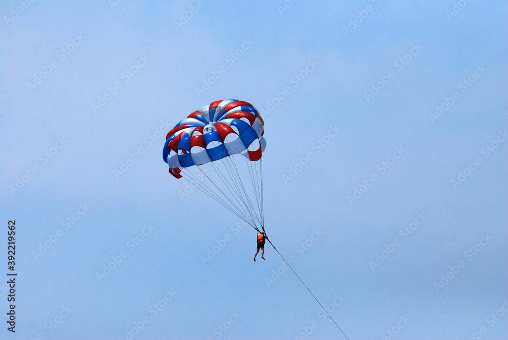 Sport Activity on the sea - parasailing over the blue sea in an bang beach hoian vietnam Sport Activity on the sea - parasailing over the blue sea in an bang beach hoian vietnam