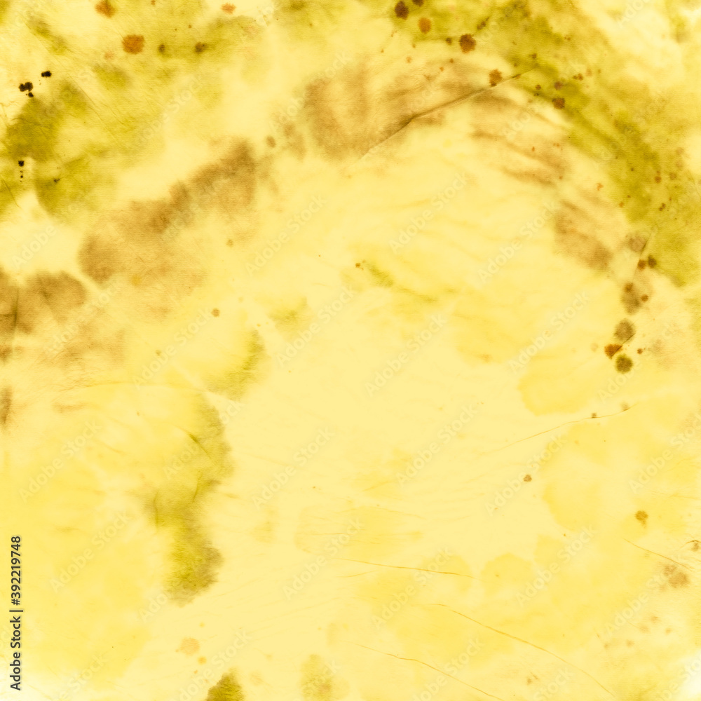 Tie Dye Spiral Background. Gold Batik Fabric. Tie Dye Spiral Background. Gold Batik Fabric.