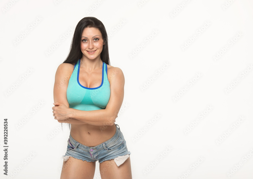 Fototapeta premium Shirtless woman in jeans shorts.
