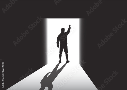 Silhouette of man standing at the door in the dark room with fist raised up facing the light, success, achievement and winning concept vector illustration