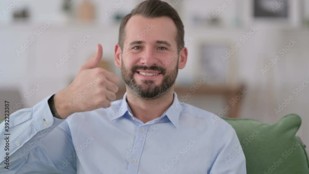 Young Man with Thumbs Up at Home Young Man with Thumbs Up at Home