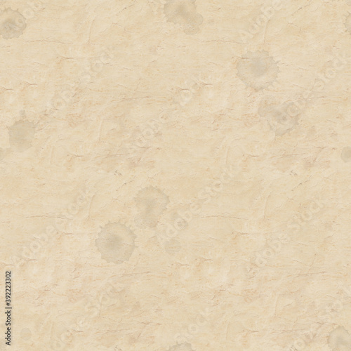 Seamless abstract pattern in vintage style with old aged yellow brown paper with faded ink stains