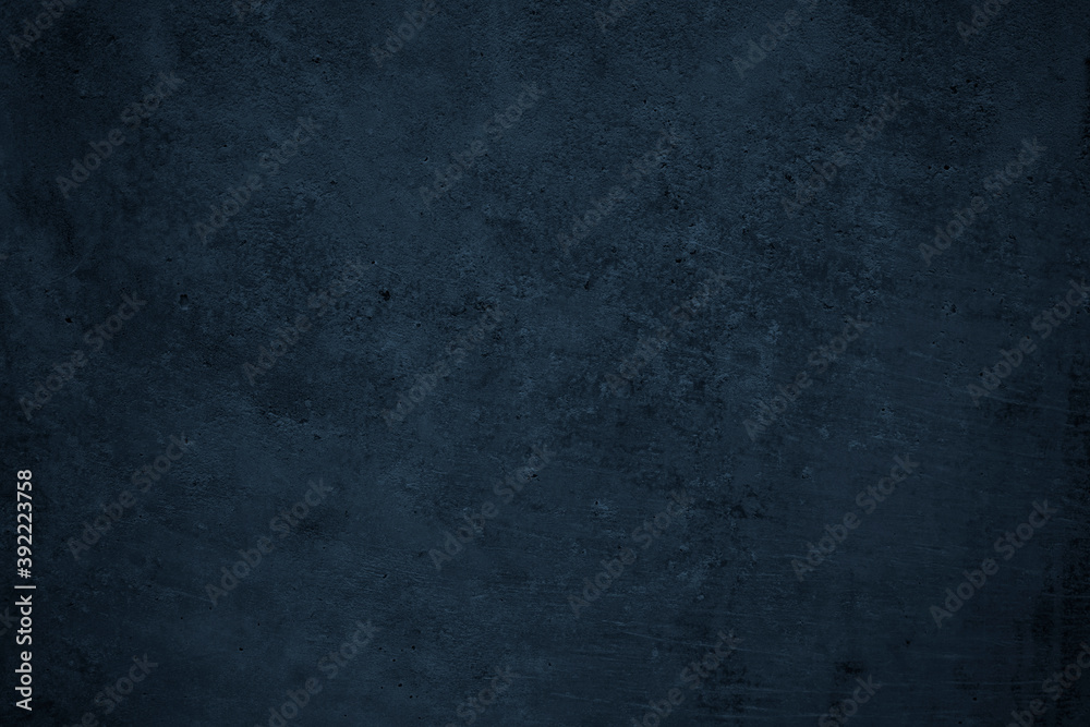 Dark grunge background. Black blue abstract rough background. Toned concrete wall texture.