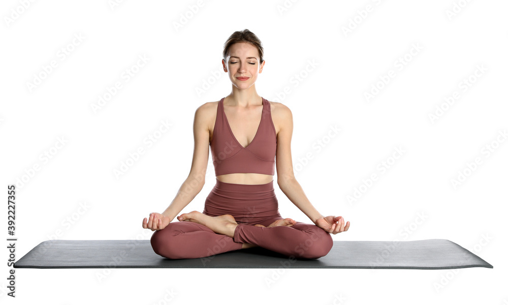 Young woman in sportswear practicing yoga on white background Young woman in sportswear practicing yoga on white background