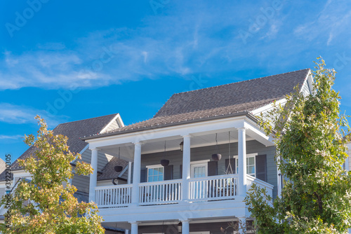 Upward view of second story balcony of urban townhome near Dallas, Texas, USA photo