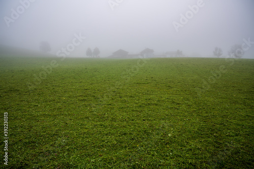 A village on the horizon in the fog