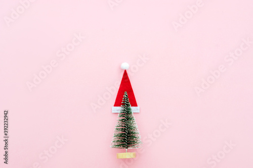 Christmas composition. Christmas gifts, pine branches, toys on pink background. Flat lay, top view.