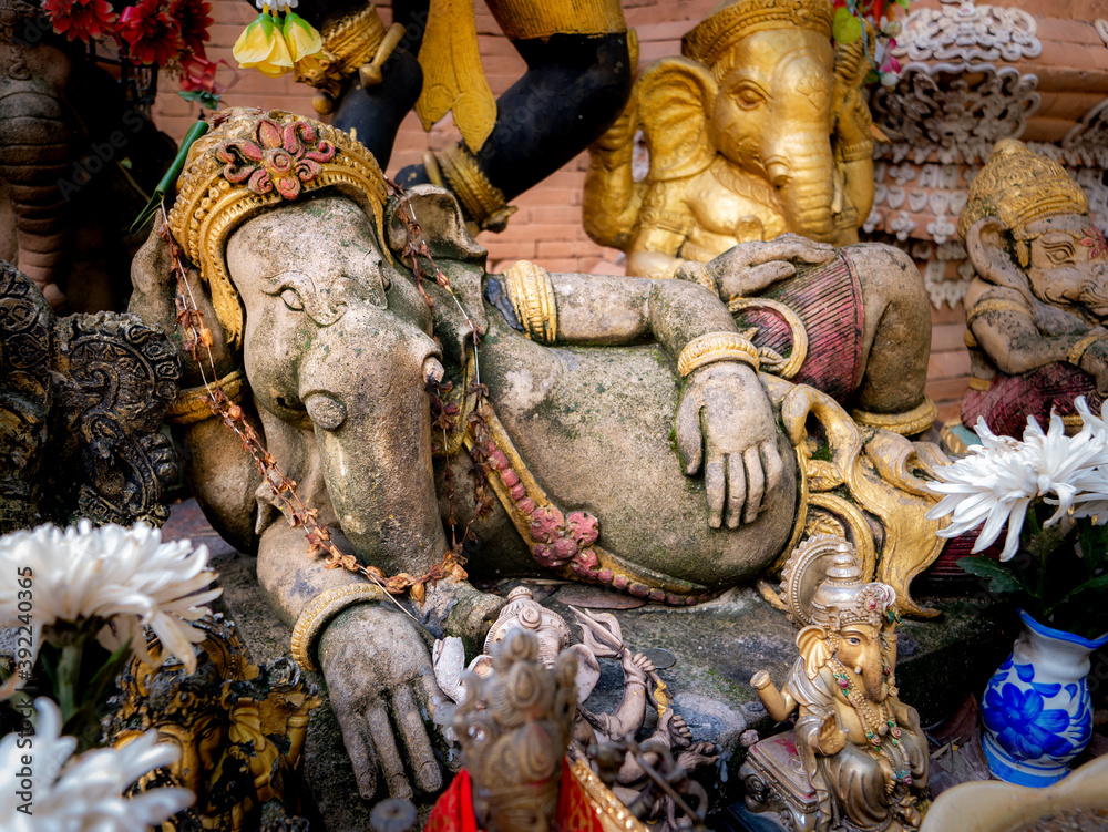 Old Ganesha Statue Lying with Another Ganesha Statues