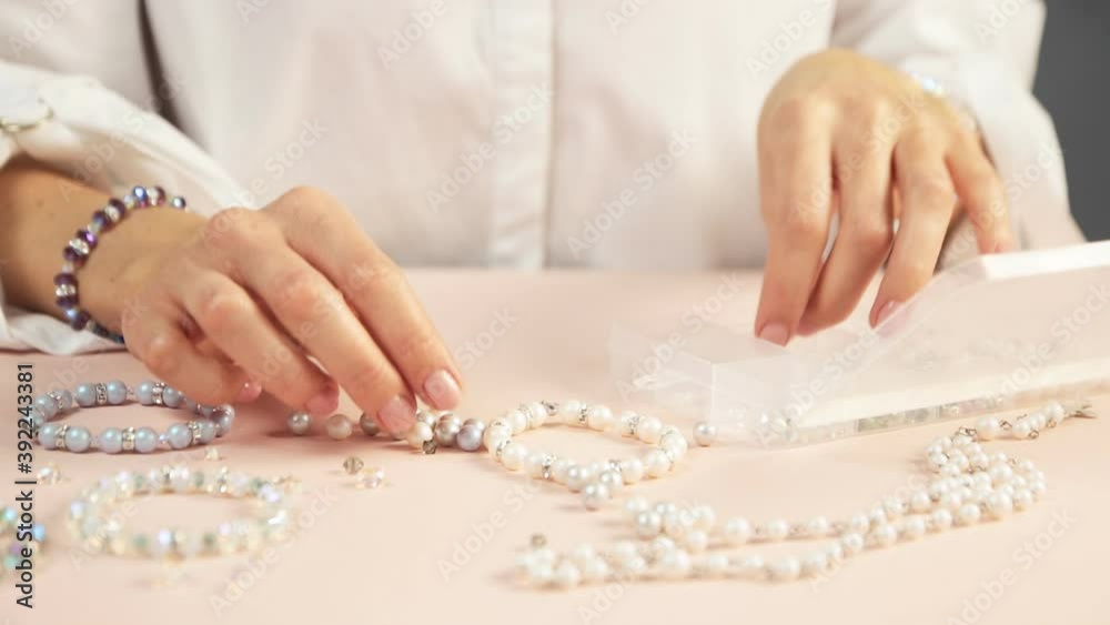 Girl needlewoman makes bracelets, handmade master. close-up, busins.