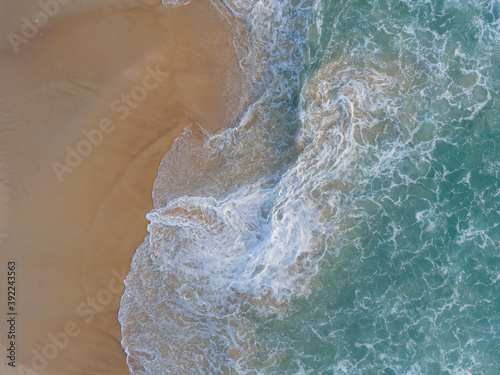 (Top view) Beach seawater wave on sandy beach. Background and travel concept.